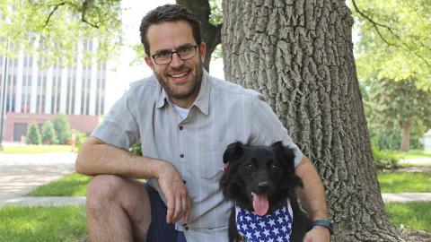 Jeffrey Stevens, founder of the Canine Cognition and Human Interaction Lab at Nebraska, poses with his dog Piper.